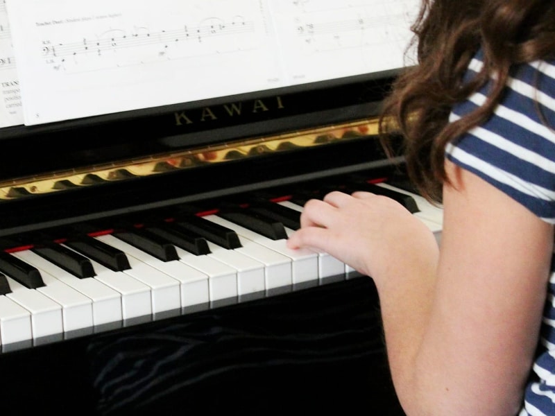 closeup of piano being played