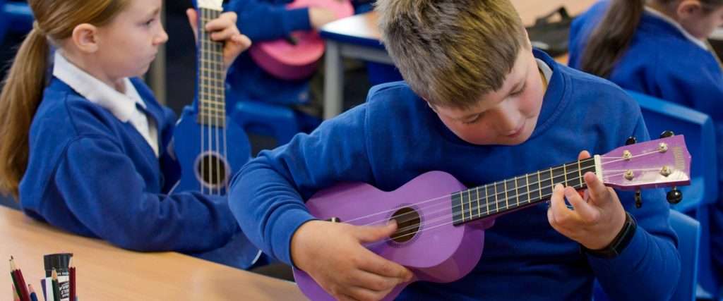 Children playing ukuleles