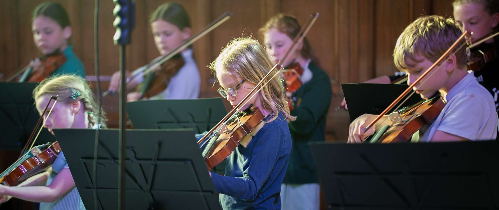 Calderdale Music Events Header Image of children performing a violin concert